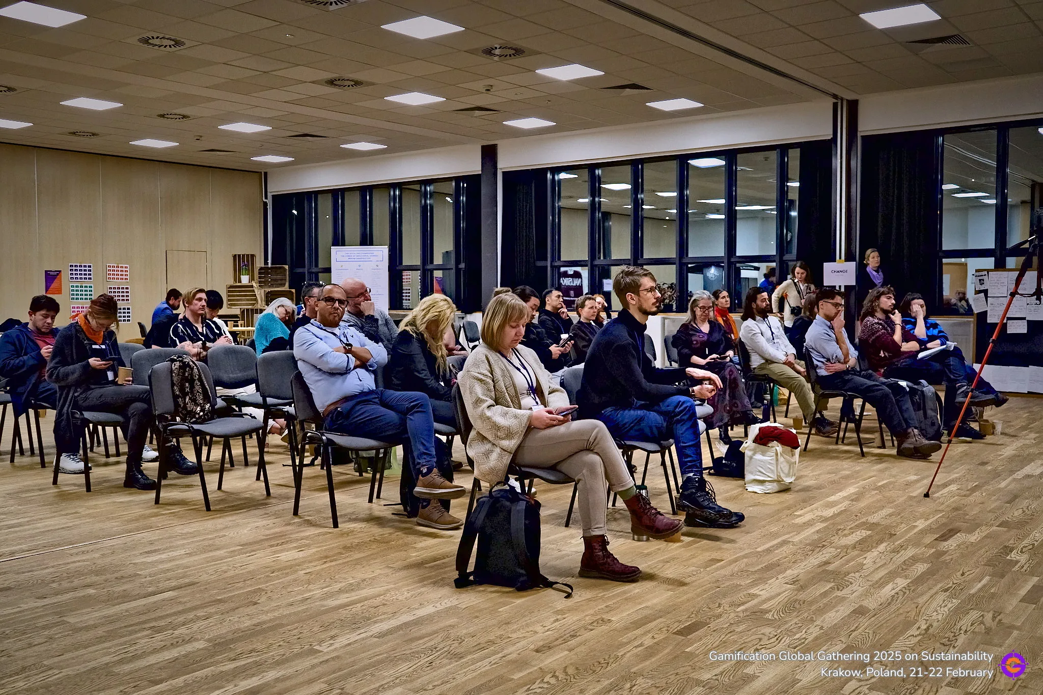 Gamification Global event attendees listening to presentation