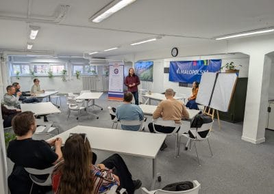 A man presenting to the whole room