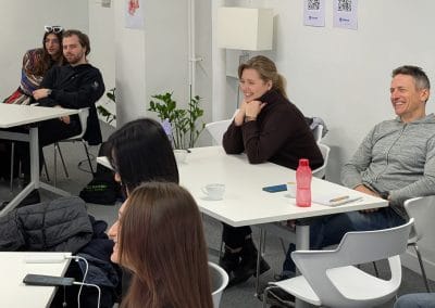 People smiling at desks